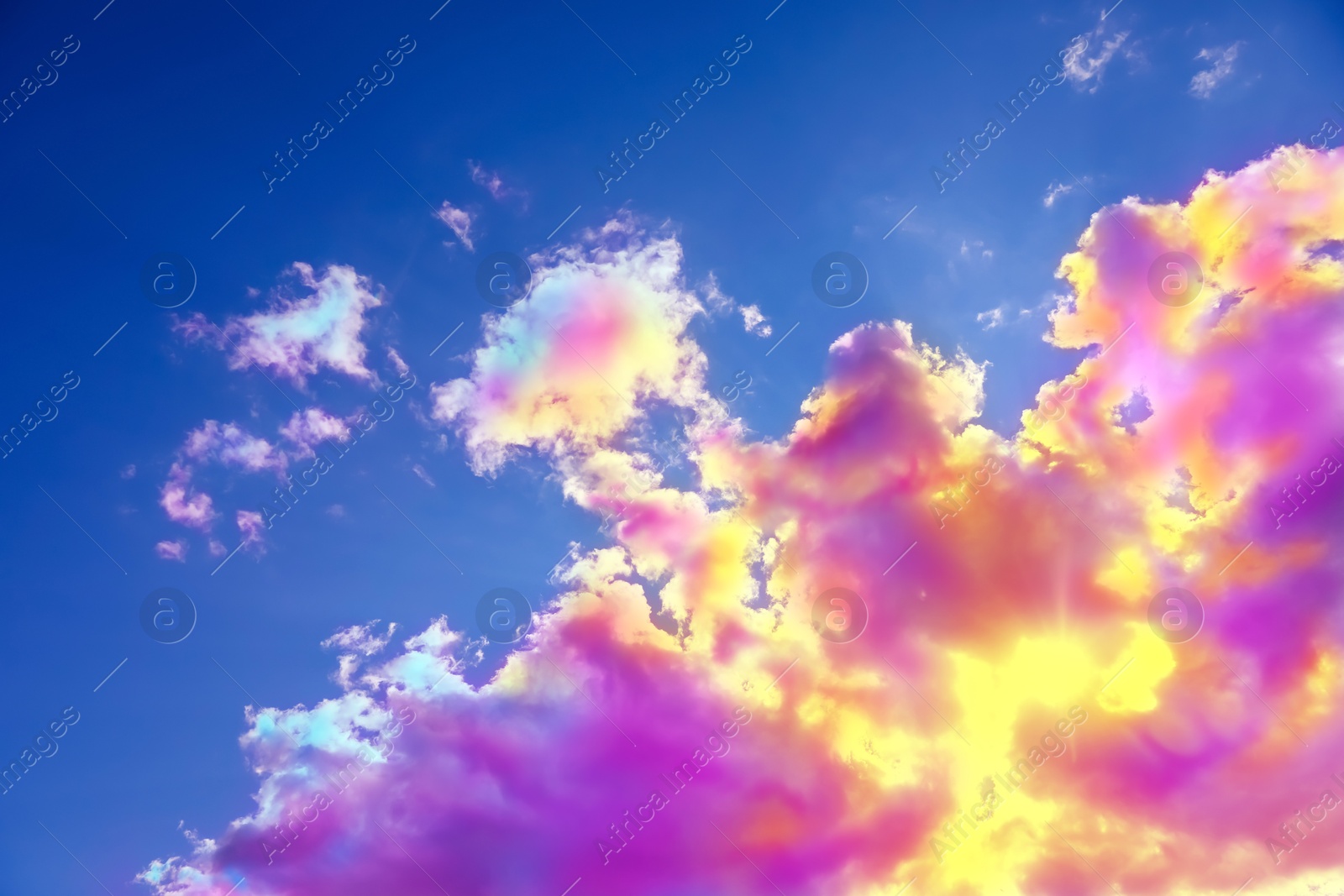 Image of Fluffy color clouds floating in beautiful blue sky