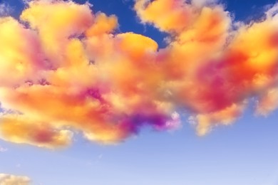 Image of Fluffy color clouds floating in beautiful blue sky