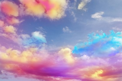 Image of Fluffy color clouds floating in beautiful blue sky
