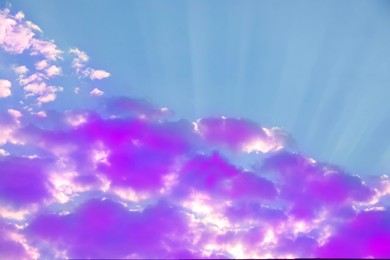 Image of Fluffy color clouds floating in beautiful blue sky