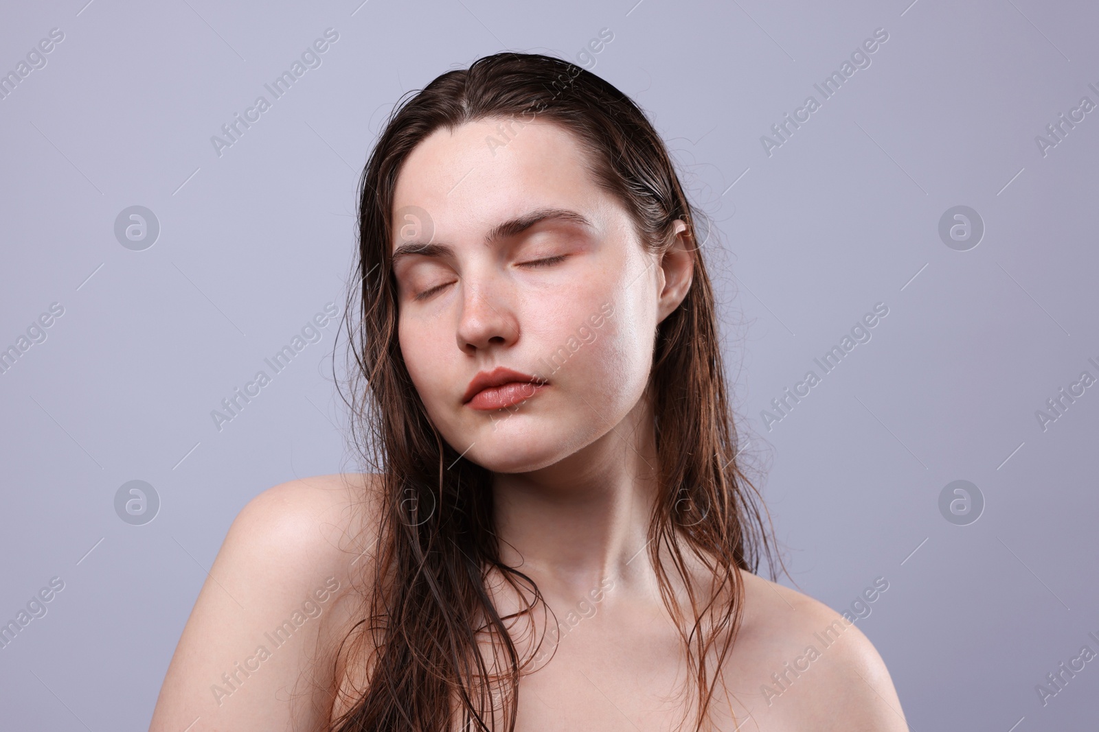 Photo of Beautiful woman with natural skin complexion on grey background, closeup