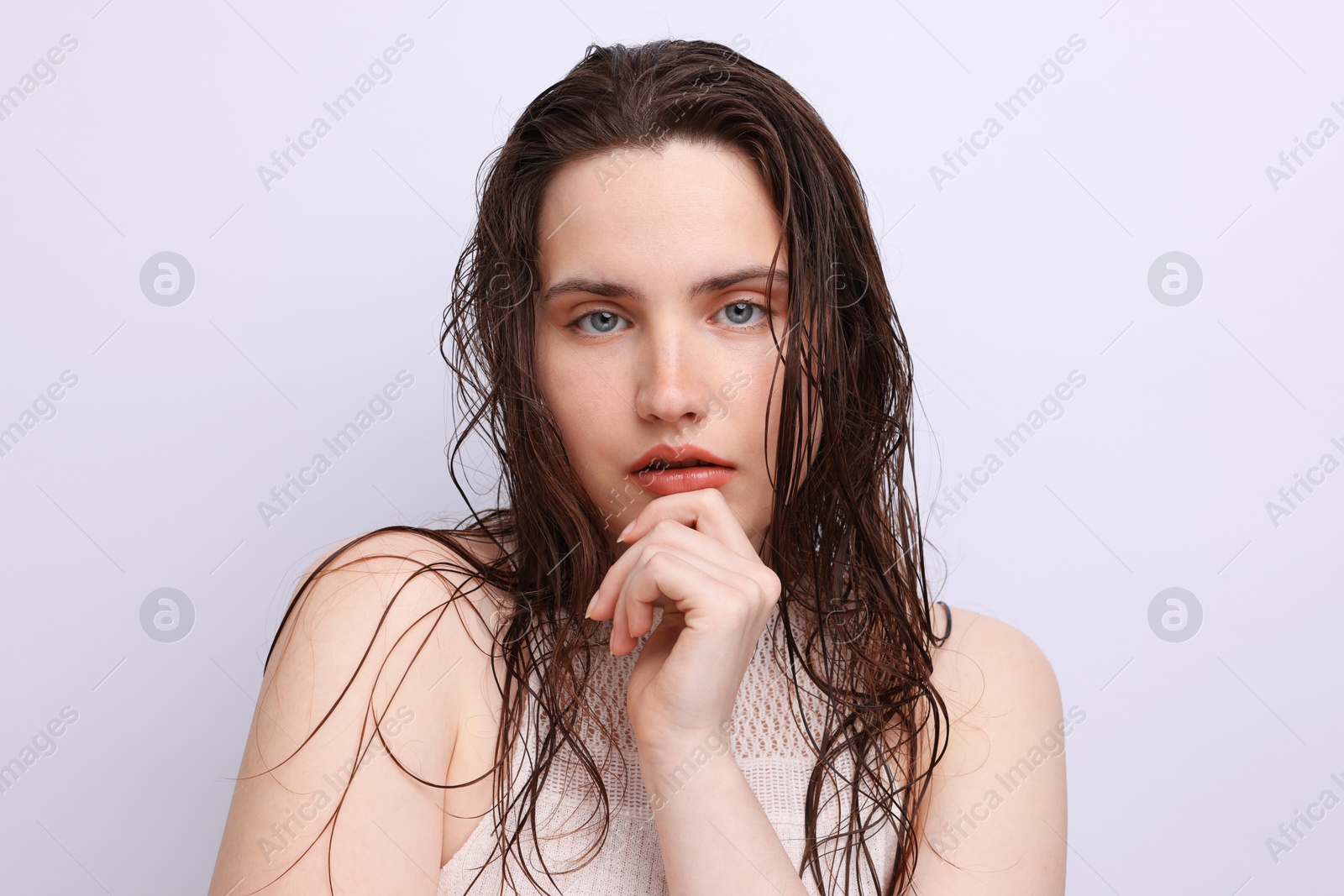 Photo of Portrait of beautiful woman with natural skin complexion on light grey background, closeup