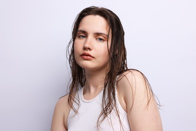 Photo of Portrait of beautiful woman with natural skin complexion on light grey background, closeup