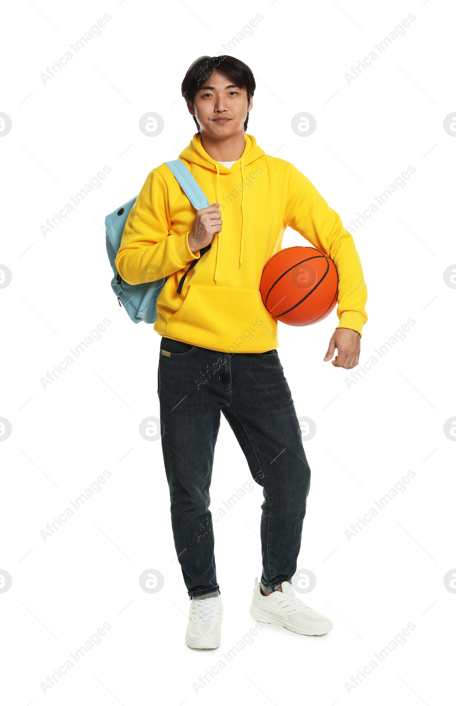 Student with basketball ball and backpack on white background Photo of Student with basketball ball and backpack on white background