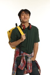 Photo of Student with headphones and backpack on white background