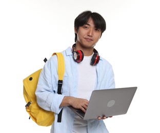 Photo of Student with headphones, laptop and backpack on white background