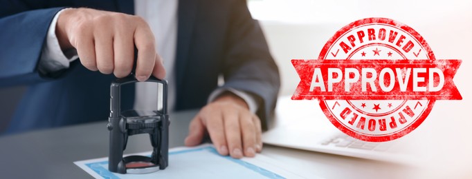 Image of Man stamping document at desk in office and red stamp with word Approved. Banner design