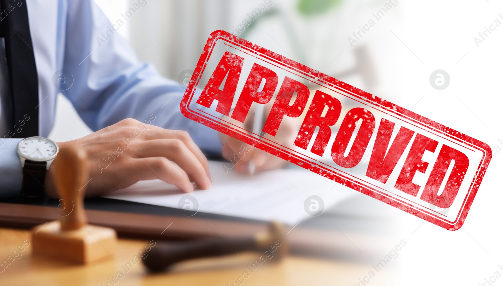 Man signing document at table in office and red stamp Approved, banner design Image of Man signing document at table in office and red stamp Approved, banner design