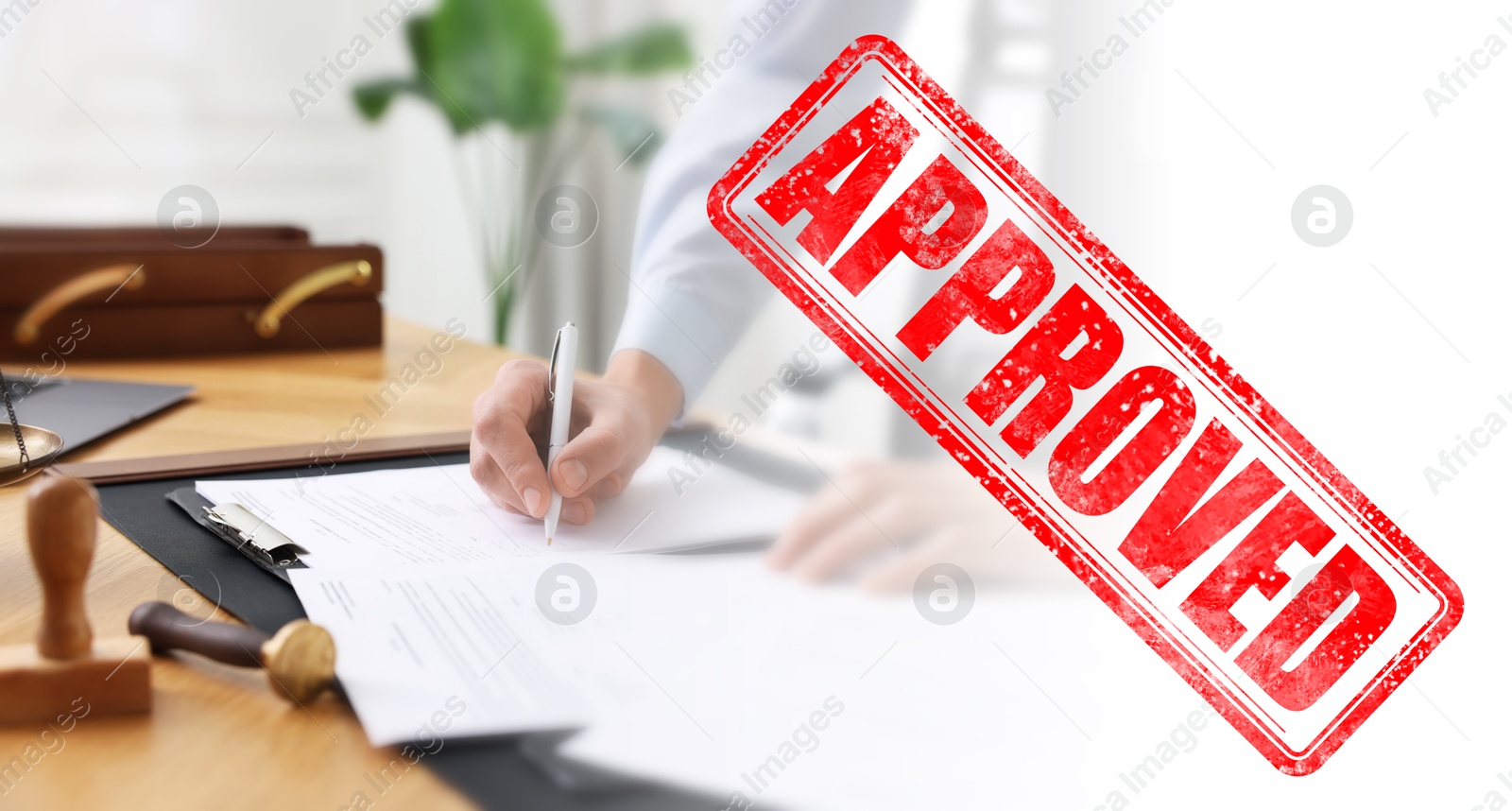 Man signing document at table in office and red stamp Approved, banner design Image of Man signing document at table in office and red stamp Approved, banner design