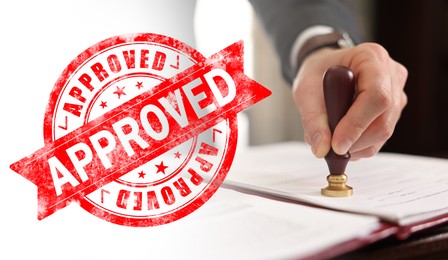 Image of Man stamping document at table and red stamp Approved, banner design