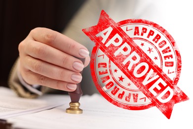 Image of Woman stamping document at table and red stamp Approved