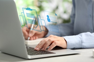 Image of Human resources manager working on laptop at table, closeup. Candidate's resume on virtual screen above computer. Recruitment and employee search