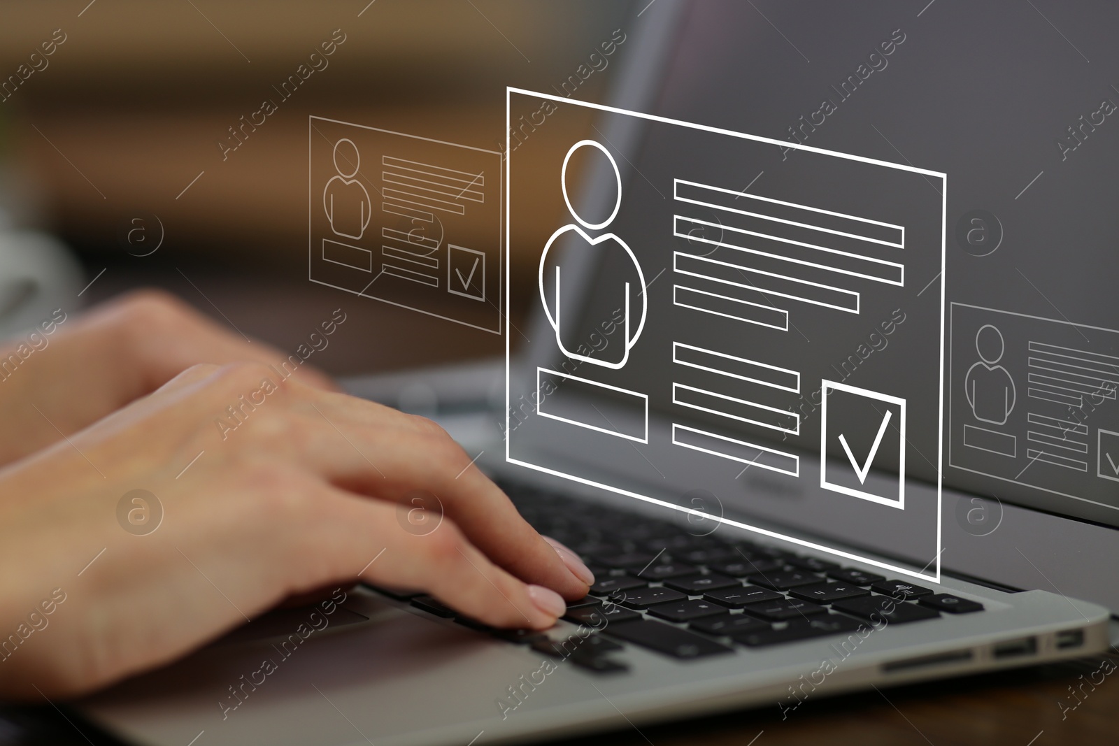 Human resources manager searching for employee on laptop at table, closeup. Resumes on virtual screen above computer. Recruitment Image of Human resources manager searching for employee on laptop at table, closeup. Resumes on virtual screen above computer. Recruitment