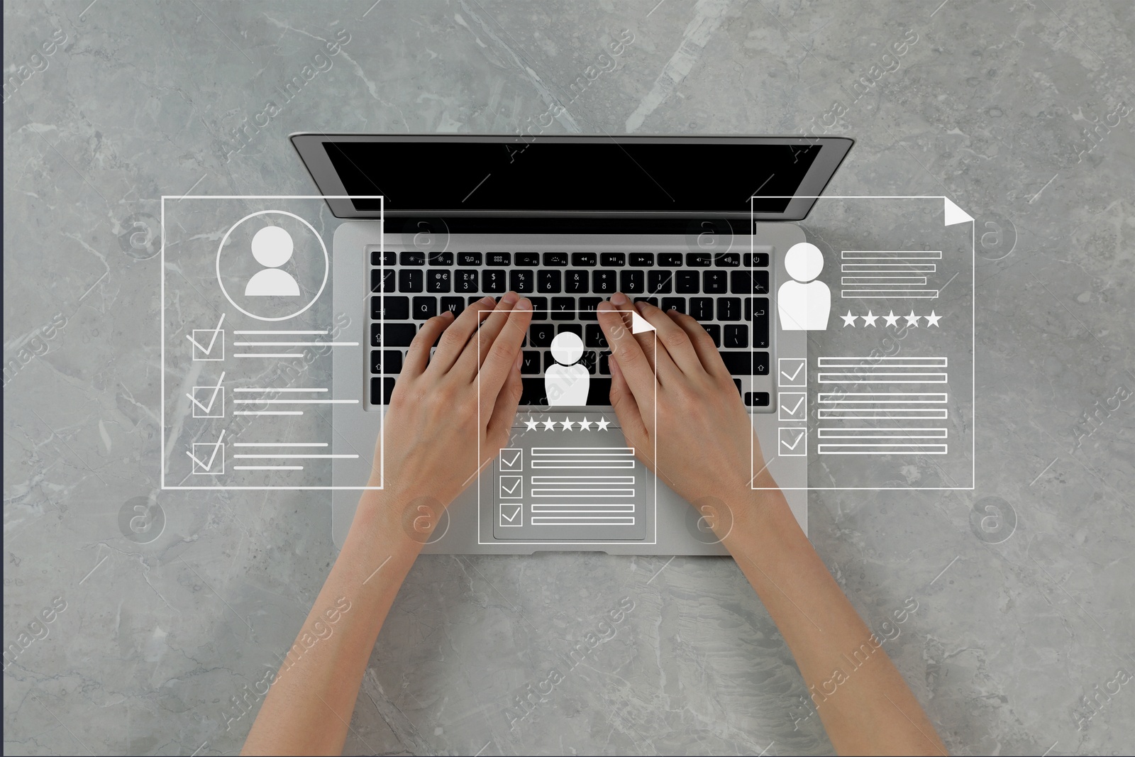 Human resources manager searching for employee on laptop at table, top view. Resumes on virtual screen above computer. Recruitment Image of Human resources manager searching for employee on laptop at table, top view. Resumes on virtual screen above computer. Recruitment