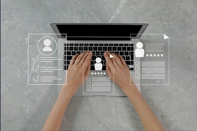 Image of Human resources manager searching for employee on laptop at table, top view. Resumes on virtual screen above computer. Recruitment