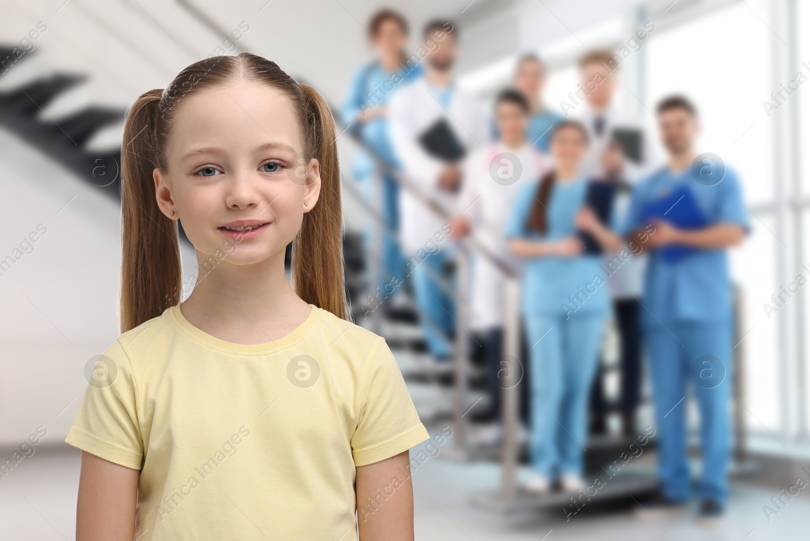 Image of Cute child and medical staff in hospital. Pediatric ward