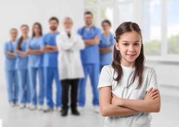 Image of Cute child and medical staff in hospital. Pediatric ward