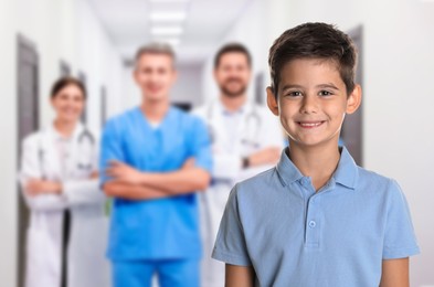 Image of Cute child and medical staff in hospital. Pediatric ward