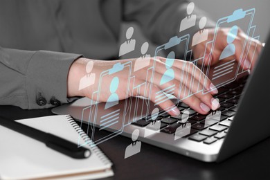 Image of Human resources manager searching for employee on laptop at table, closeup. Resumes on virtual screen above computer. Recruitment