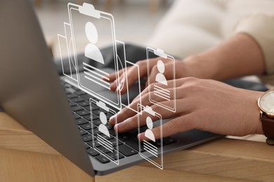Image of Human resources manager working on laptop at table, closeup. Resumes on virtual screen above computer. Recruitment and employee search