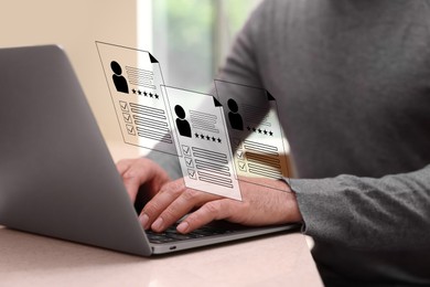 Image of Human resources manager searching for employee on laptop at table, closeup. Resumes on virtual screen above computer. Recruitment