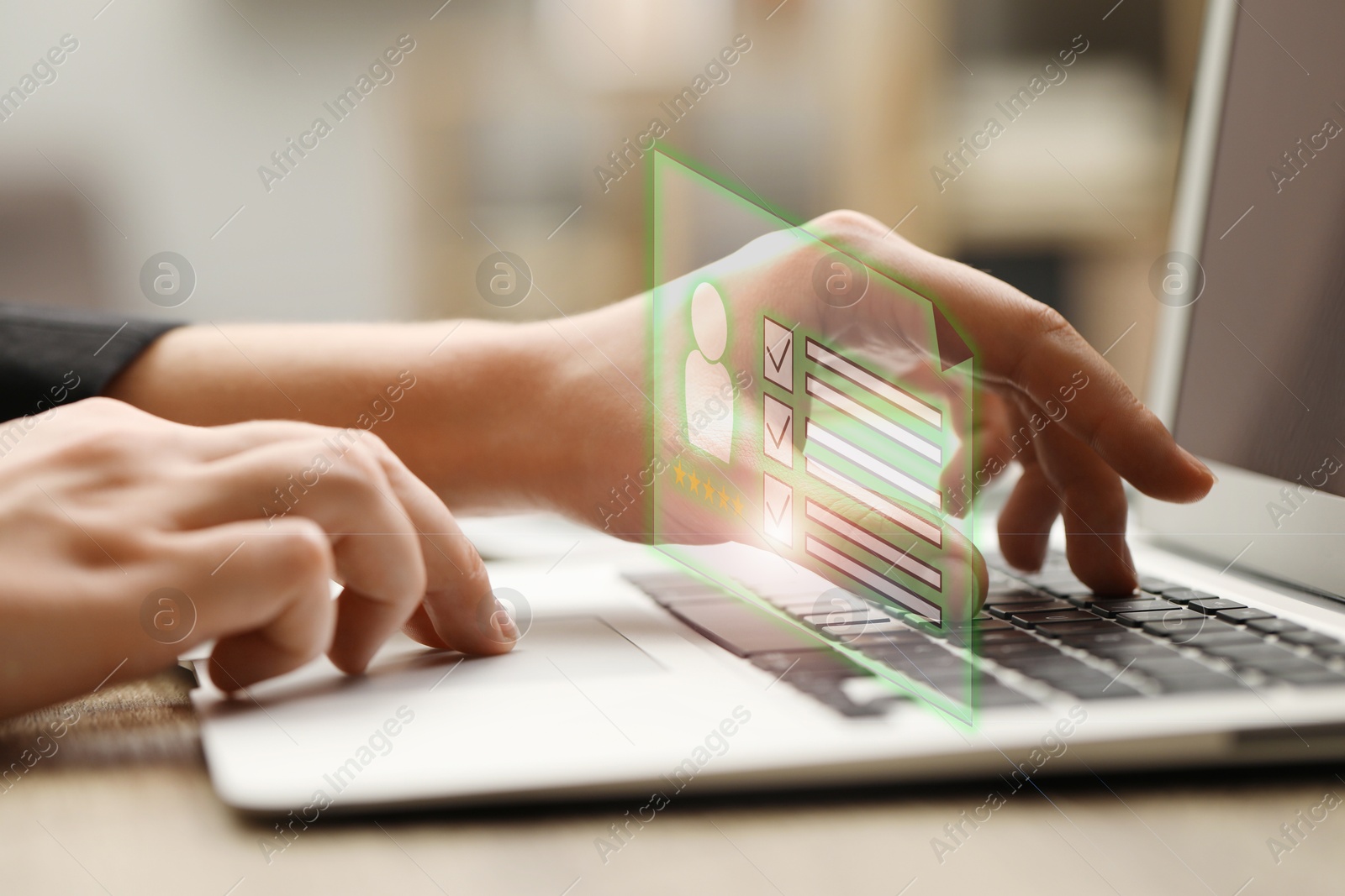 Human resources manager working on laptop at table, closeup. Candidate's resume on virtual screen above computer. Recruitment and employee search Image of Human resources manager working on laptop at table, closeup. Candidate's resume on virtual screen above computer. Recruitment and employee search