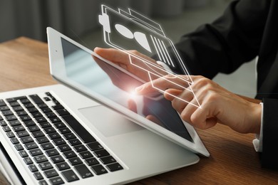 Image of Human resources manager working on tablet computer at table, closeup. Candidate's resume on virtual screen above device. Recruitment and employee search