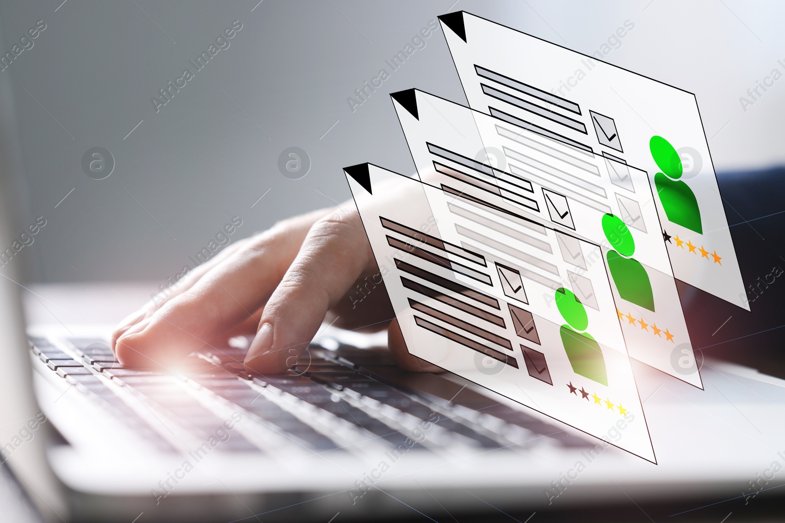Human resources manager searching for employee on laptop at table, closeup. Resumes on virtual screen above computer. Recruitment Image of Human resources manager searching for employee on laptop at table, closeup. Resumes on virtual screen above computer. Recruitment