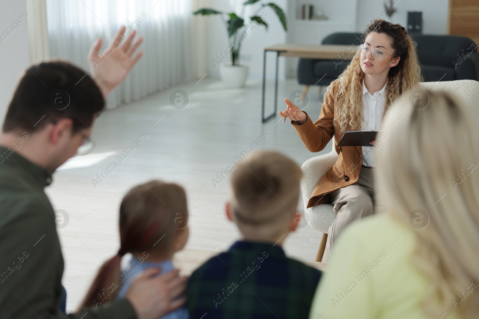 Family having consultation with psychologist in office, selective focus Photo of Family having consultation with psychologist in office, selective focus