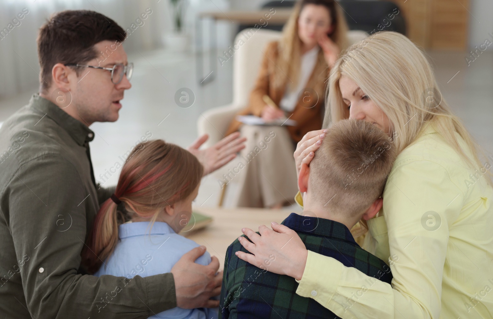 Family having consultation with psychologist in office, selective focus Photo of Family having consultation with psychologist in office, selective focus