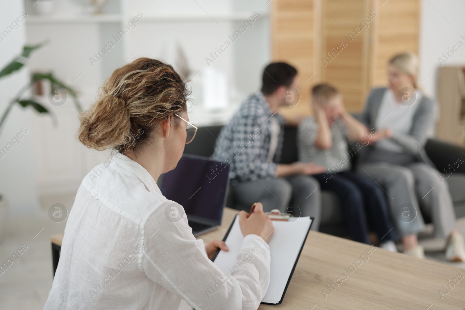 Family psychologist working in office, selective focus Photo of Family psychologist working in office, selective focus