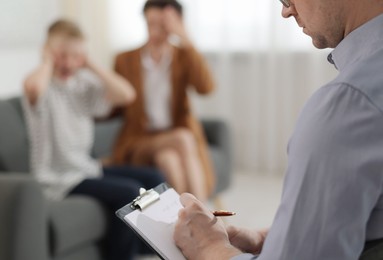 Photo of Psychologist having consultation in office, selective focus