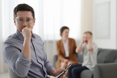 Photo of Psychologist having consultation in office, selective focus