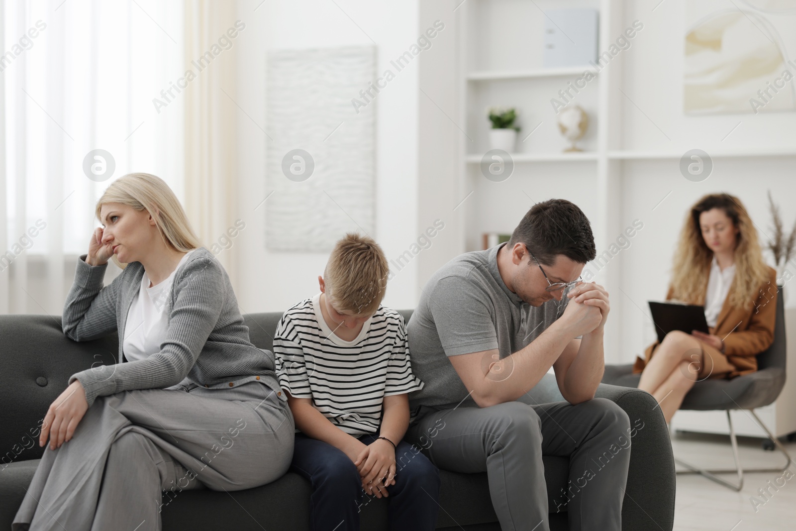 Offended family during consultation with psychologist in office, selective focus Photo of Offended family during consultation with psychologist in office, selective focus