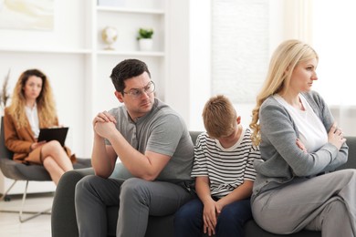 Photo of Offended family during consultation with psychologist in office, selective focus