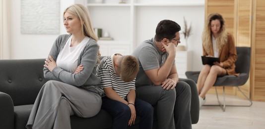 Photo of Offended family during consultation with psychologist in office, selective focus