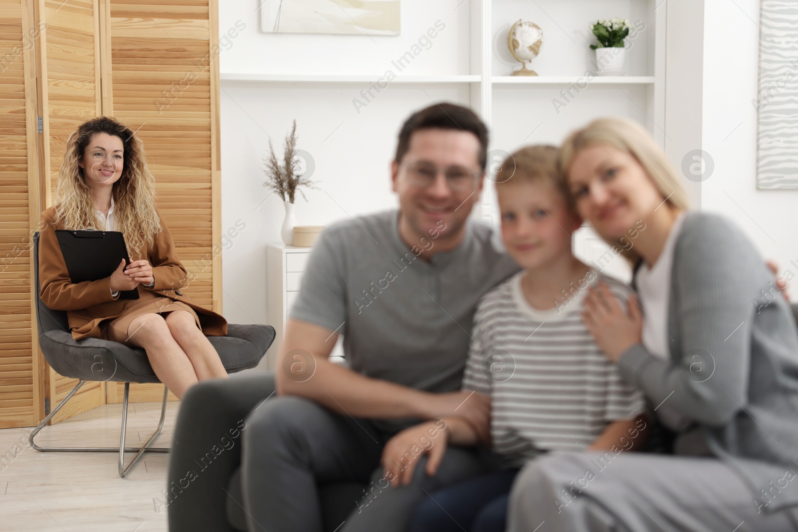 Happy family after consultation with psychologist in office, selective focus Photo of Happy family after consultation with psychologist in office, selective focus