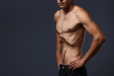Photo of Man suffering from anorexia on grey background, closeup. Space for text