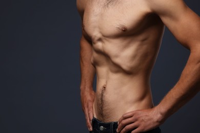Photo of Man suffering from anorexia on grey background, closeup. Space for text