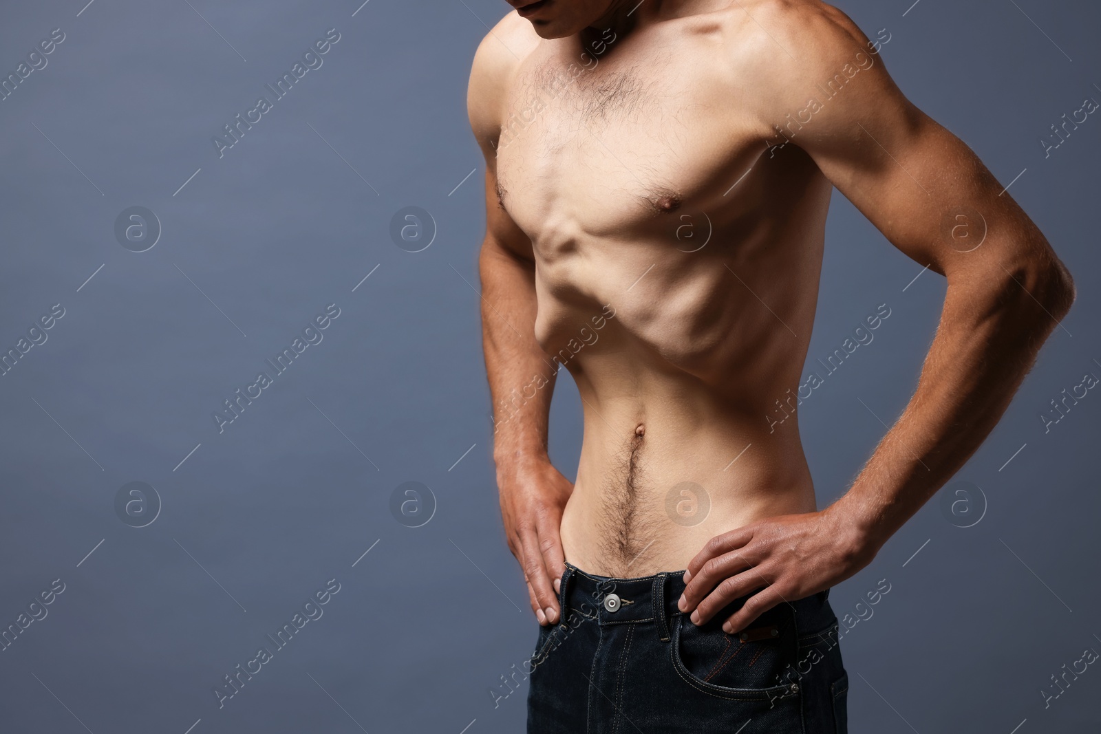 Man suffering from anorexia on grey background, closeup. Space for text Photo of Man suffering from anorexia on grey background, closeup. Space for text