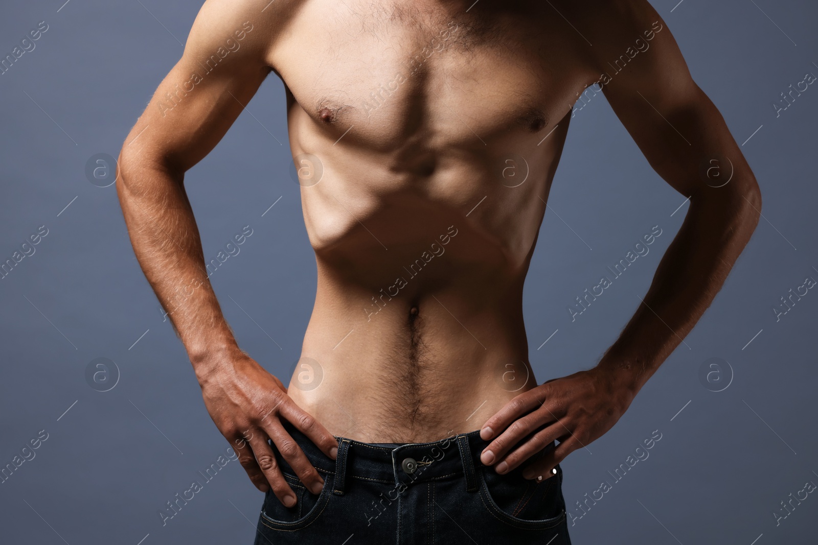 Man suffering from anorexia on grey background, closeup Photo of Man suffering from anorexia on grey background, closeup