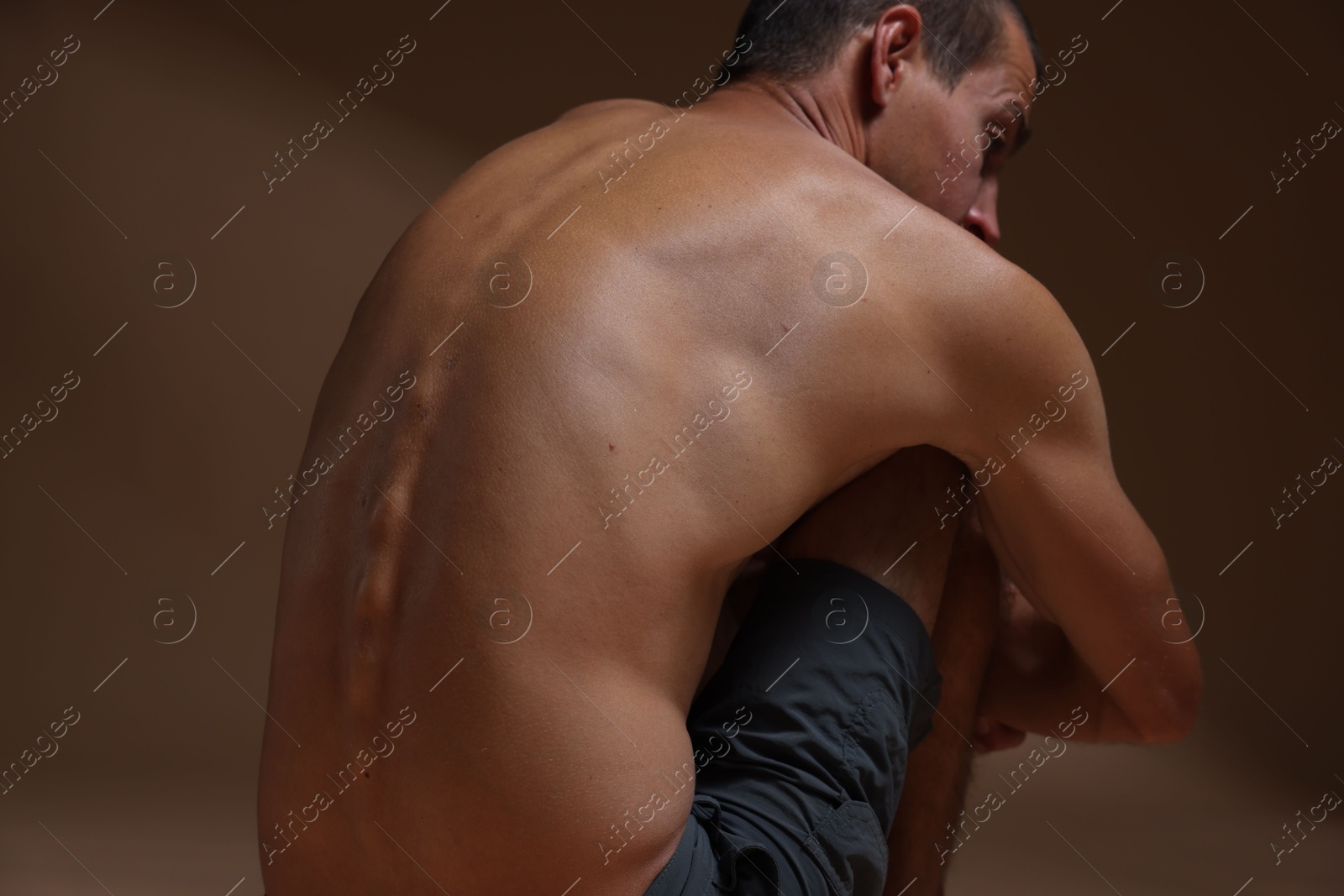Man suffering from anorexia on beige background, closeup Photo of Man suffering from anorexia on beige background, closeup