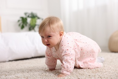 Photo of Cute little baby girl crying at home
