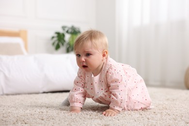 Photo of Cute little baby girl crying at home