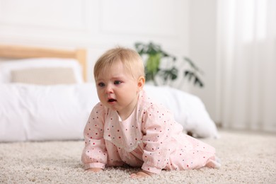 Photo of Cute little baby girl crying at home