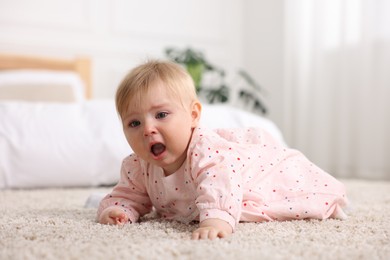 Photo of Cute little baby girl crying at home