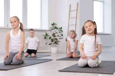 Photo of Group of children on yoga mats in class