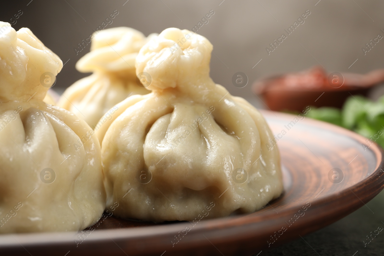 Delicious cooked khinkali served on table, closeup Photo of Delicious cooked khinkali served on table, closeup