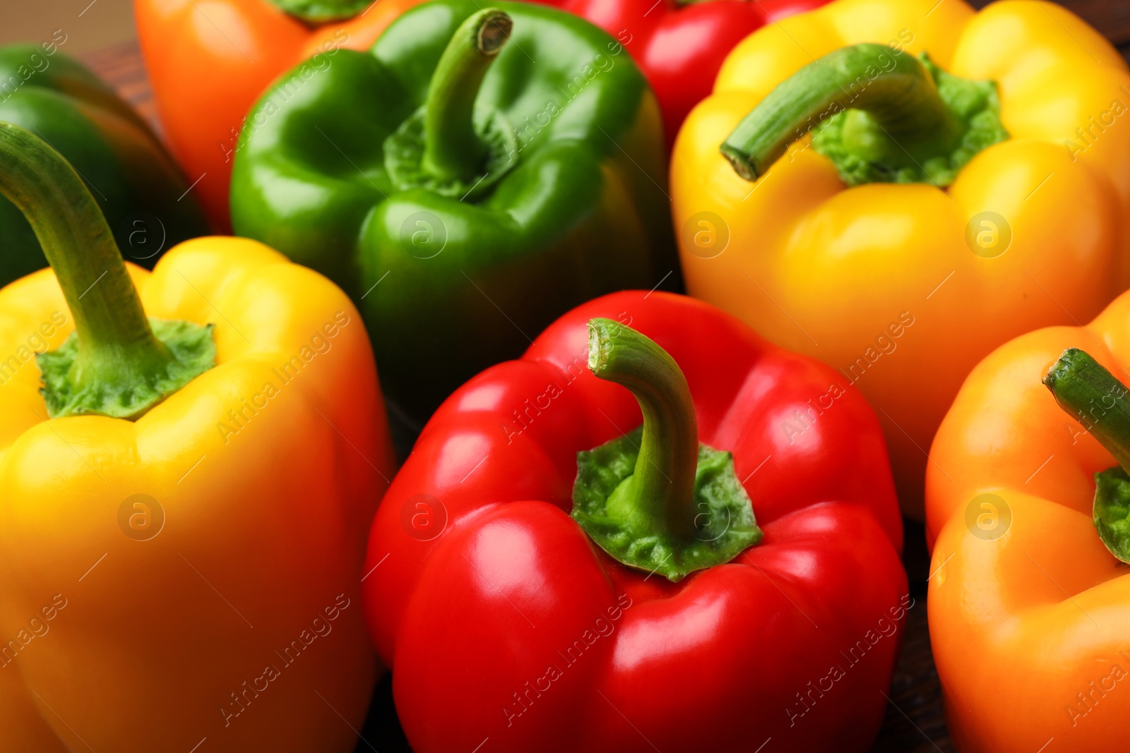 Fresh colorful bell peppers on table, closeup Photo of Fresh colorful bell peppers on table, closeup