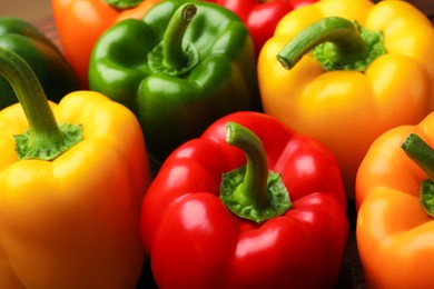 Photo of Fresh colorful bell peppers on table, closeup